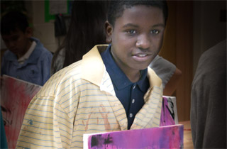Student with finished self-portrait.